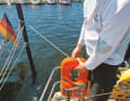 Equipment: The wind resistance of a surface increases in proportion to the square of the wind speed. The light breeze in the harbour is deceptive. Even small surfaces, such as a rescue collar or railing dress, can add up to enormous resistance. Best to stow away