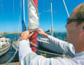 Headsail: Roll up the furling sail as tightly as possible, wind up the genoa sheet two or three more turns to secure it, tighten the sheets by hand and cover them. A short end can be pulled through the clew and knotted around the sheet as an additional safety device. Or, even better, you can retrieve the headsail completely, as you are unlikely to want to leave the harbour under sail ...