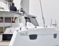 The steering position is halfway between the deck and the superstructure roof, ...