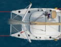 1. lay both mooring lines on slips and fiddle a little to take the strain off the mooring lines. This makes it easier to remove them from the cleats. Cast off and haul in the leeward stern line.