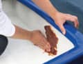 The compound adheres very well to the wet GRP and the leak is plugged in no time at all