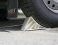 2 Secure the trailer with wheel chocks. This provides additional support on slippery slipways or if the car rolls