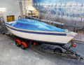 The deck, which is not to be painted until the end, is masked off. The underwater hull is also protected