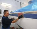 Fill any damage, holes or cracks with epoxy filler, sand these work areas thoroughly again