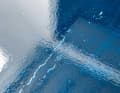 Incompatible: The two-component topcoat has dissolved the substrate. One-component paint must be used here