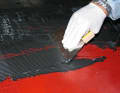4. the adhesive from the accessories is applied to the deck and spread with the notched trowel