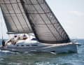 Good perspective. The Faurby looks elegant in position and from leeward. The sheer deck is striking, even the centreboard adjustment is concealed aft