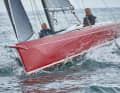 Typical daysailer. Stretched lines, little freeboard, no railing. The bowsprit is now permanently attached to the new boat for the first time