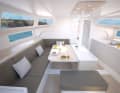 Large windows in the superstructure and hull allow an almost unrestricted view. The galley is attached to the side, the bulky box for the swivelling keel is striking