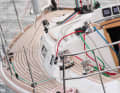 The foresail is sheeted on the superstructure and is equipped with barber haulers for sheeted courses