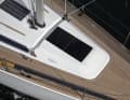 Two flush hatches provide light below deck, with the rear skylight already in the saloon. The self-tacking rail is moulded in