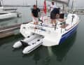 Ingenious. The tender can be pulled in or out of its garage using a sheet hoist