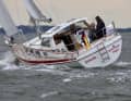 The helmsman stands to windward or sits to leeward