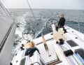 Cockpit in cruising mode: Two optional storage boxes can be anchored in the cockpit floor in front of the steering columns. They extend the dents of the First 36 into a sunbathing area. The cushions are also an extra