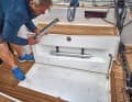 Arcona 385 cockpit table and supports are stored in a compartment in the cockpit floor