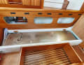 Arcona 385 The stainless steel diesel tank is embedded under the sofa berth, fresh water is stored on the opposite side