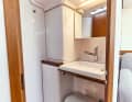 First 36 Very small and simple bathroom. The washbasin can be folded up