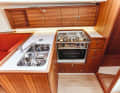 J 112 E The working height is low, which is tiring to work at. Lots of storage space, little surface area