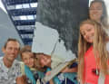 The Erichsen family with the broken rudder of their sailing yacht