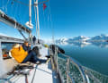 Picture-book weather in the far north. The "Qilak" glides calmly along against a breathtaking backdrop