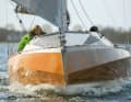 Modern lines: Deck jump, chines, negative stem and wide stern. The effect is martial and exciting