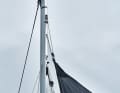 With a 1:2 reduction halyard, you can build up plenty of tension and still avoid a lot of compression pressure in the mast