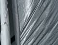 Pull the lower tie down over the last few metres, then the cloth rolls without creases