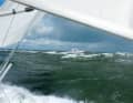 Dark clouds, green-grey sea. Under sail it is a sporting endeavour, under engine spectacularly unexciting