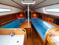 Asymmetrical: lockers to starboard, aft to port - in the shipyard's brochure it's the other way round. The benches are long and wide enough to accommodate extra crew during regattas