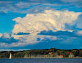 When the air cools down, water vapour becomes visible in the atmosphere - in the form of clouds in the sky. If the air cools further, precipitation occurs. The picture shows a mighty cumulus cloud over the Bay of Kiel