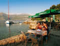 Here you sit in the front row: a typical konoba bay with a small jetty