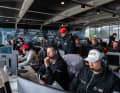 Pour cela, ils s'assoient avec tous les entraîneurs dans une "Coach Booth".