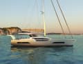 Unusual design. The hull is cut out in the centre, creating maximum transparency through the large superstructure windows. This is possible thanks to the laterally recessed running deck.