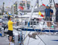 Helpers in yellow T-shirts provide support at the jetties.