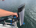 The lightweight motor can be carried into the dinghy with one hand.