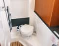 Bavaria Cruiser 33: In the toilet room of the Bavaria there is an open cupboard for oilskins and plenty of space for showering