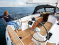 With two wheels, the cockpit offers a better passage, but the table is ample. The mainsheet has been moved to the superstructure and is out of reach of the helmsman