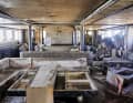 The interior, designed by Remi Tessier, is completely destroyed, with mud and dirt in every corner, as here in the salon.