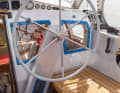Clever details: The steering wheel is mounted on a swivelling column on the companionway bulkhead - so it can be steered from under the sprayhood