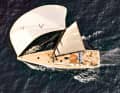 Fast: The genoa bag and crew are moved aft for roomy sails with a gennaker. The racing mainsail is widely flared at the top and adorned with the Union Jack.