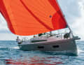 Running. Leaning casually in the pushpit, the Oceanis 34.1 can be steered with two fingers