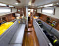 The restored interior remains seaworthy with high leeboards and saloon berths