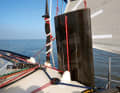 The two rudders can be raised individually and are connected with tubular rods