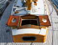 The forward hatch opens to the side with two flaps and is fitted with portholes