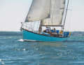 The partially restored wooden long keeler underway on the Solent, where Rose lived, started and finished his round-the-world voyage