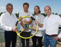 SailGP CEO Russell Coutts hands over the yellow helm to the Germany SailGP team with racing team owner Thomas Riedel (right), Sebastian Vettel and helmsman Erik Heil