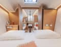 A wide double door connects the foredeck with the saloon. This links the two rooms both functionally and visually