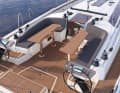 New with two cockpit tables. This leaves the passageway open and wide sunbeds are possible in the cockpit