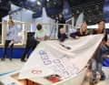 In der Sailing School finden verschiedene Wettberwerbe, auch ein Opti-Aufbau-Contest ist dabei