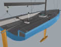 The mainsheet is run via a high sheet triangle at the stern. The main boom is as long as possible because the rig is very far aft.